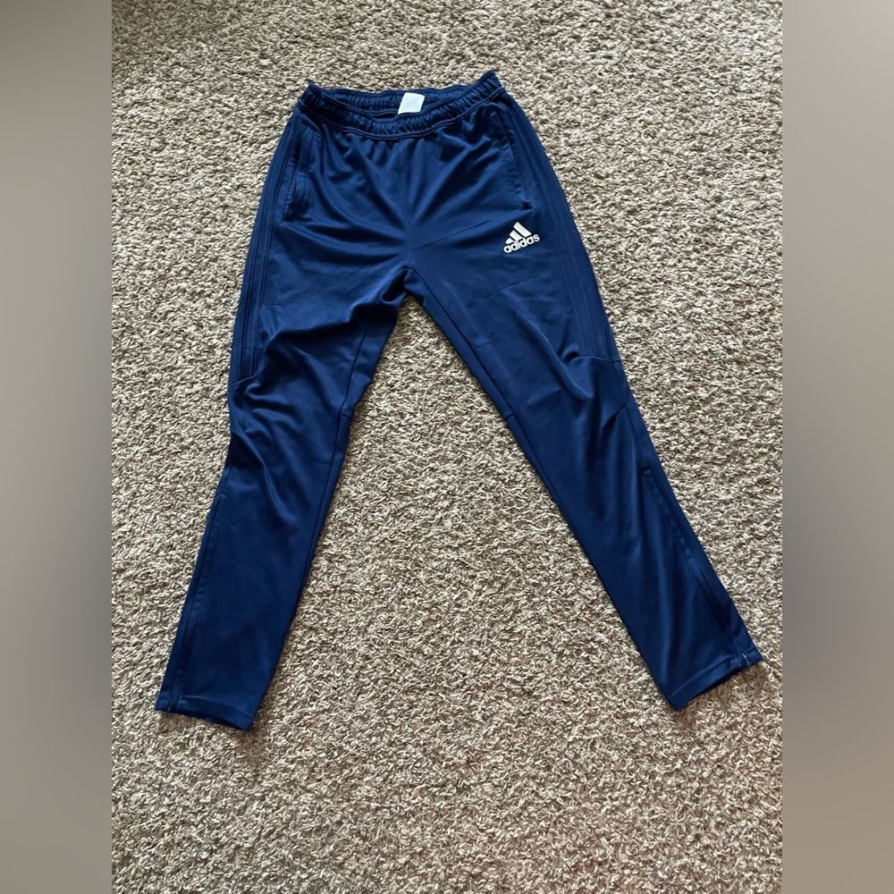 Boys Adidas pants with white stripes and zippers near the ankles!